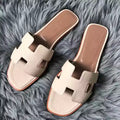 HERMES ORAN SLIDE SANDALS IN BETON CLEMENCE LEATHER – HMSD107