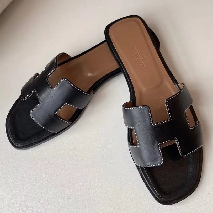 HERMES ORAN SLIDE SANDALS IN BLACK SWIFT CALFSKIN – HMSD117