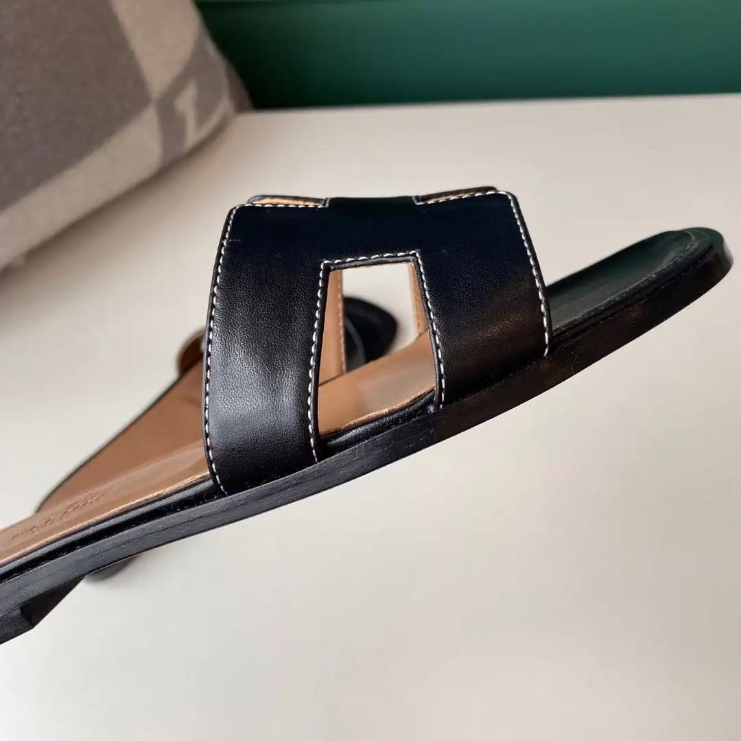 HERMES ORAN SLIDE SANDALS IN BLACK SWIFT CALFSKIN – HMSD117
