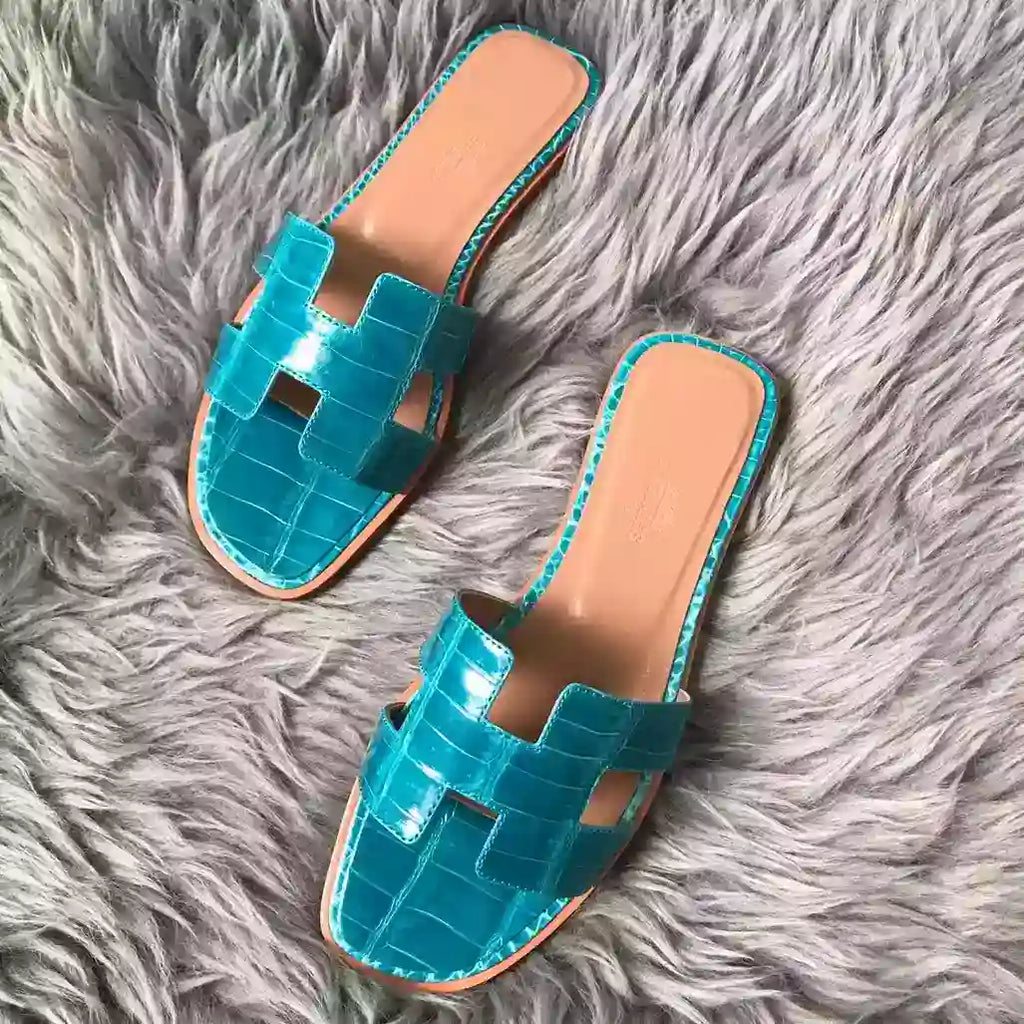 HERMES ORAN SLIDE SANDALS IN BLUE PAON SHINY NILOTICUS CROCODILE SKIN – HMSD061