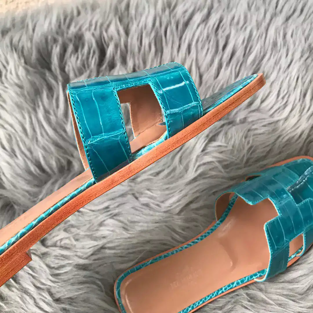 HERMES ORAN SLIDE SANDALS IN BLUE PAON SHINY NILOTICUS CROCODILE SKIN – HMSD061