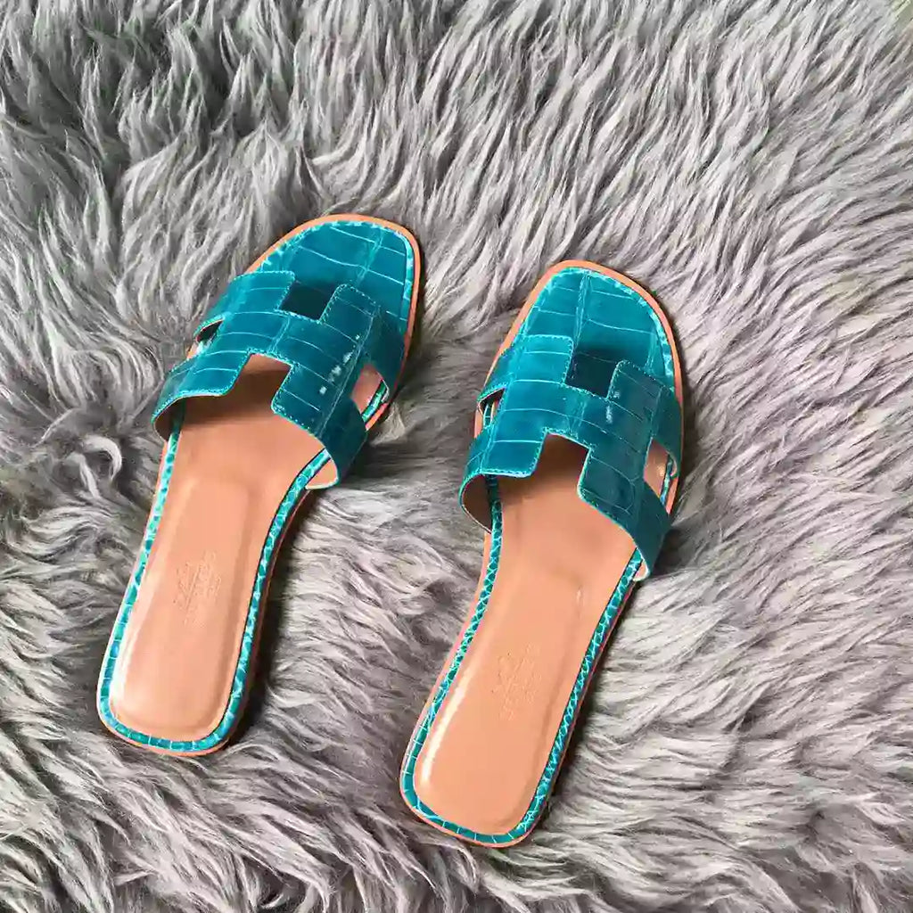 HERMES ORAN SLIDE SANDALS IN BLUE PAON SHINY NILOTICUS CROCODILE SKIN – HMSD061