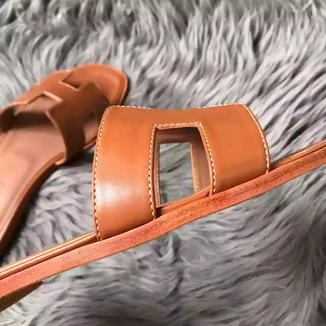 HERMES ORAN SLIDE SANDALS IN BROWN SWIFT CALFSKIN – HMSD129