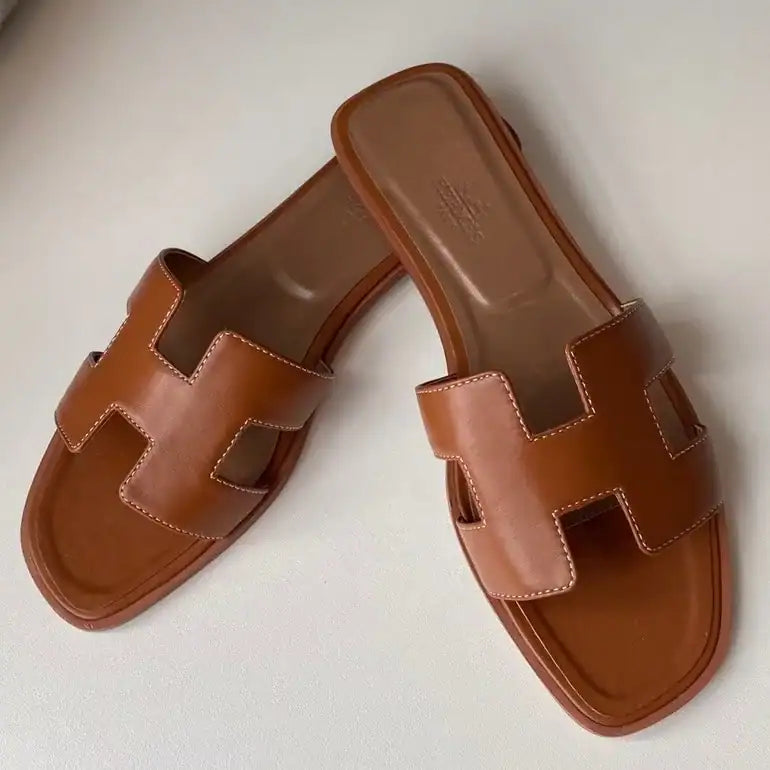 HERMES ORAN SLIDE SANDALS IN GOLD SWIFT CALFSKIN – HMSD114