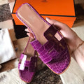 HERMES ORAN SLIDE SANDALS IN PURPLE SHINY NILOTICUS CROCODILE SKIN – HMSD054