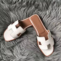 HERMES ORAN SLIDE SANDALS IN WHITE SWIFT CALFSKIN – HMSD130