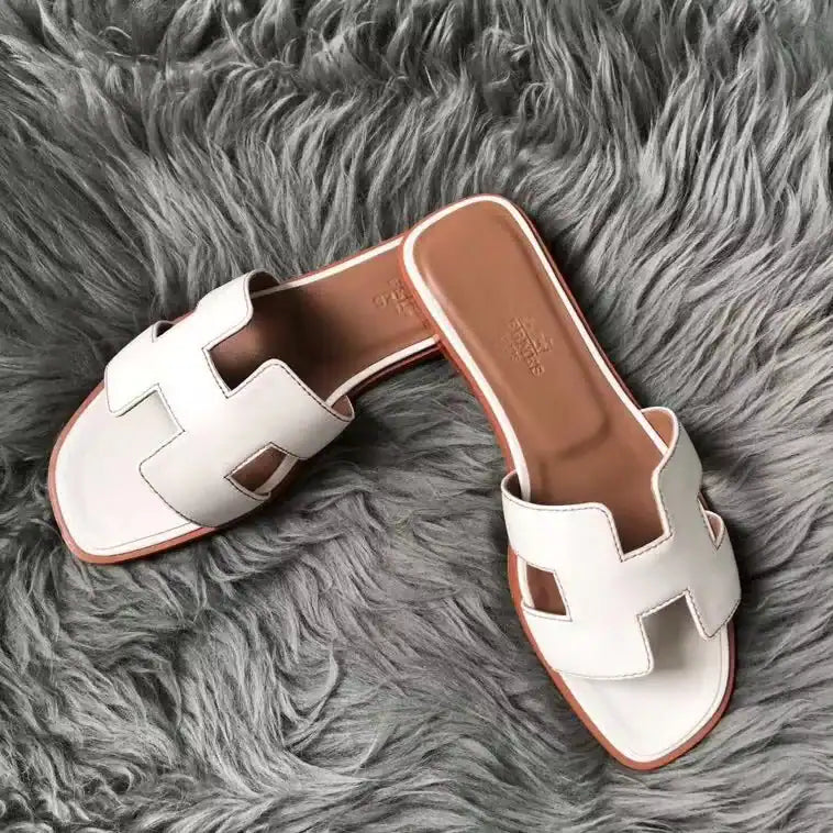 HERMES ORAN SLIDE SANDALS IN WHITE SWIFT CALFSKIN – HMSD130