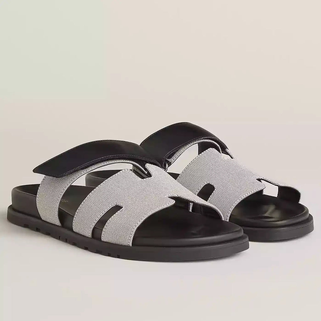HERMES WOMEN’S CHYPRE SANDALS IN CANVAS WITH BLACK LEATHER – HMSD014