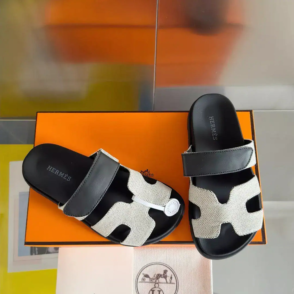 HERMES WOMEN’S CHYPRE SANDALS IN CANVAS WITH BLACK LEATHER – HMSD014