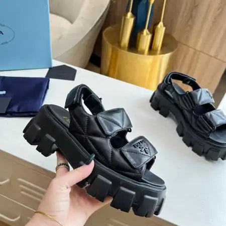 PRADA MONOLITH FLATFORM SANDALS IN BLACK NAPPA LEATHER – PSD019