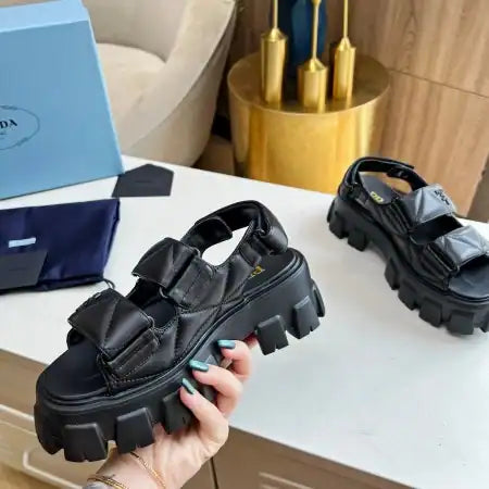 PRADA MONOLITH FLATFORM SANDALS IN BLACK NAPPA LEATHER – PSD019
