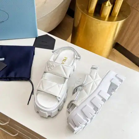 PRADA MONOLITH FLATFORM SANDALS IN WHITE NAPPA LEATHER – PSD020