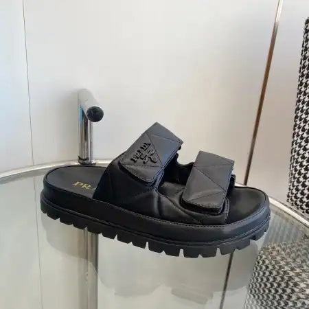 PRADA WOMEN’S SANDALS IN BLACK PADDED NAPPA LEATHER – PSD023