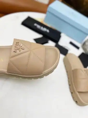 PRADA WOMEN’S SLIDES IN BEIGE QUILTED NAPPA LEATHER – PSD082