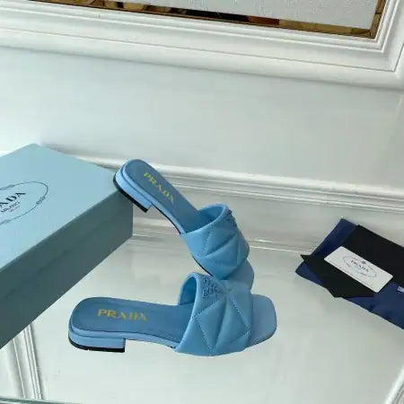 PRADA WOMEN’S SLIDES SANDALS IN LIGHT BLUE NAPPA LEATHER – PSD075