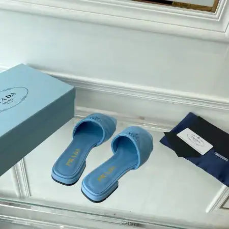 PRADA WOMEN’S SLIDES SANDALS IN LIGHT BLUE NAPPA LEATHER – PSD075
