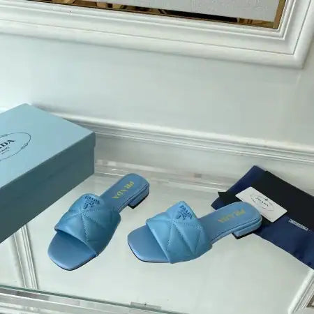 PRADA WOMEN’S SLIDES SANDALS IN LIGHT BLUE NAPPA LEATHER – PSD075
