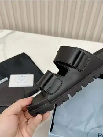 PRADA WOMEN’S STRAP SLIDES SANDALS IN BLACK CALFSKIN – PSD027